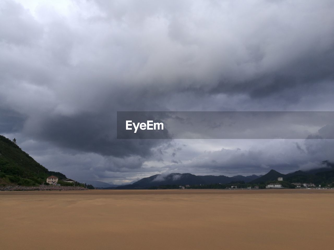 SCENIC VIEW OF MOUNTAINS AGAINST CLOUDY SKY