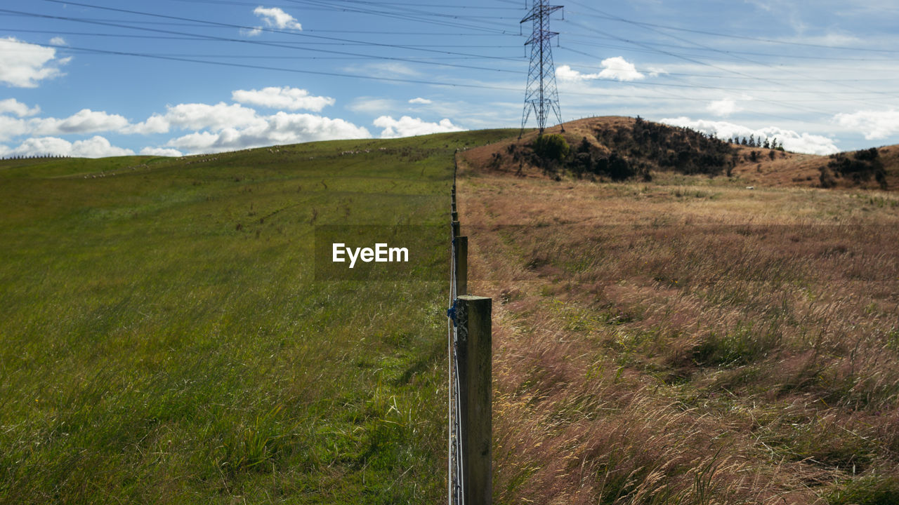 ELECTRICITY PYLON ON FIELD