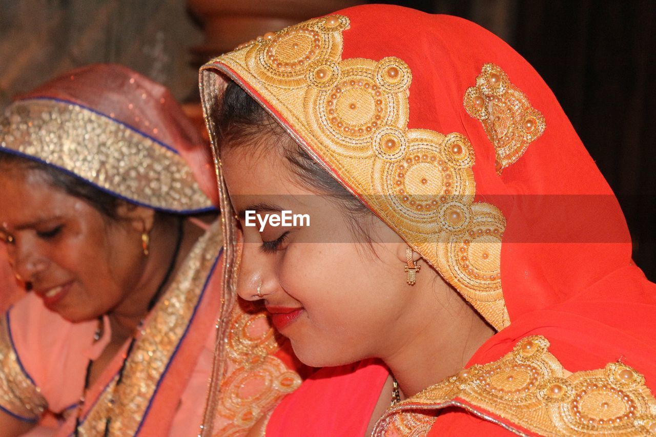 Close-up of women wearing saris