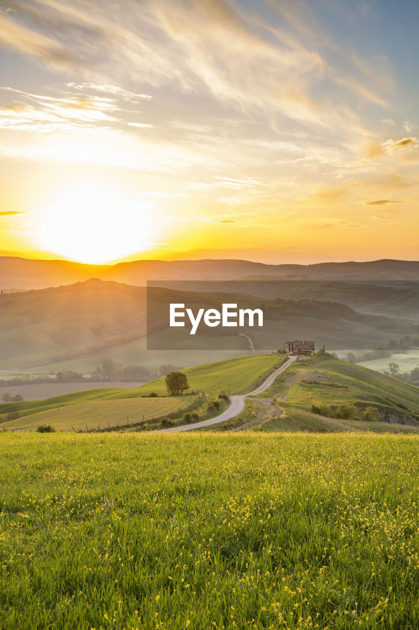 Sunrise over the hills of a rural landscape