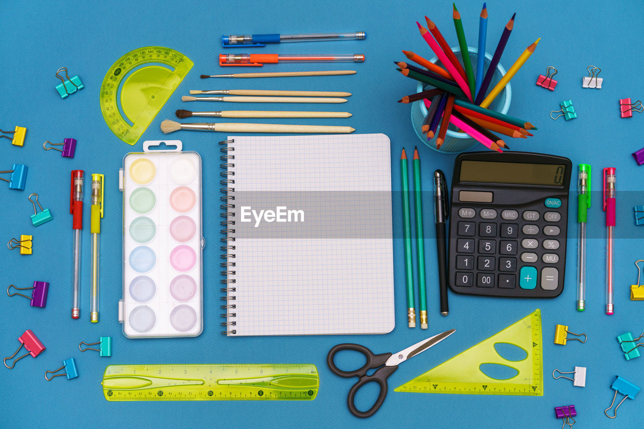 A pattern of brightly colored stationery accessories. back to school. education concept