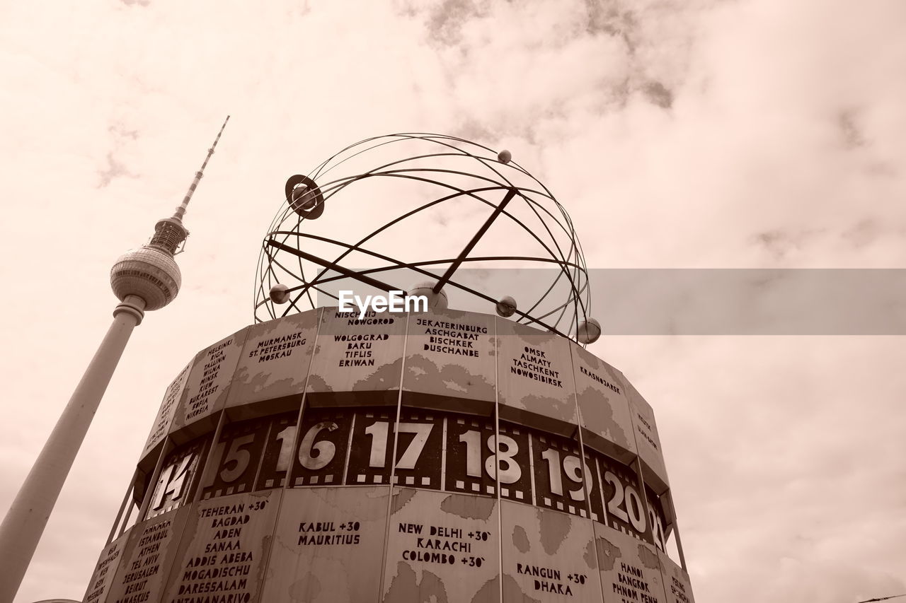 LOW ANGLE VIEW OF COMMUNICATIONS TOWER AGAINST SKY