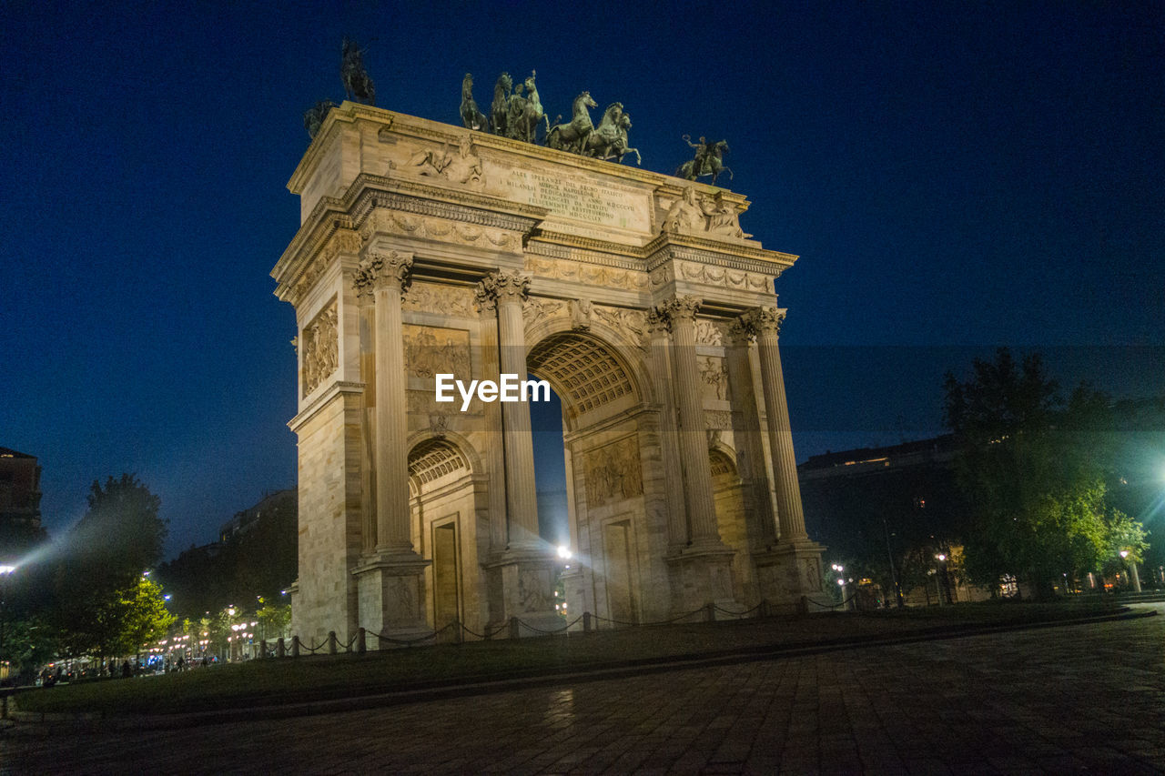 LOW ANGLE VIEW OF ILLUMINATED BUILDING