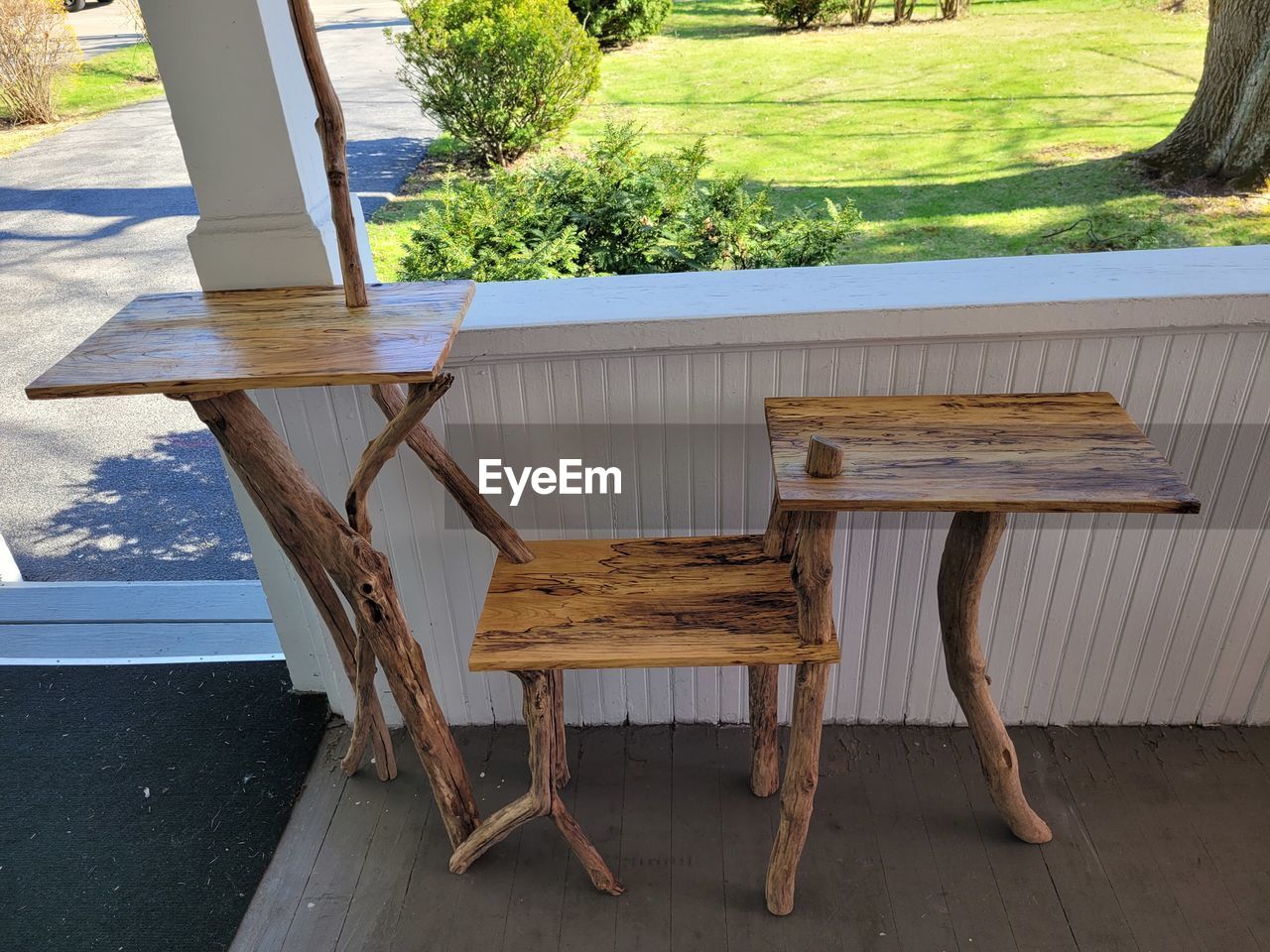 seat, furniture, wood, table, chair, plant, nature, no people, day, tree, outdoors, bench, architecture, absence, empty, front or back yard, relaxation, outdoor structure, sunlight