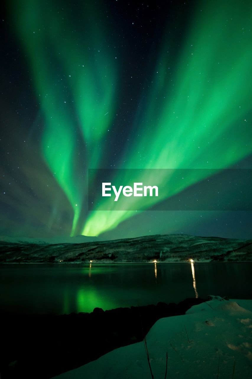 Scenic view of sea against sky at night