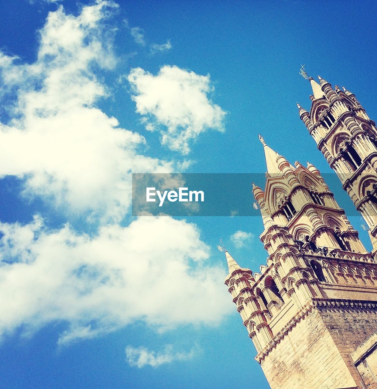 Low angle view of palermo cathedral against sky in city