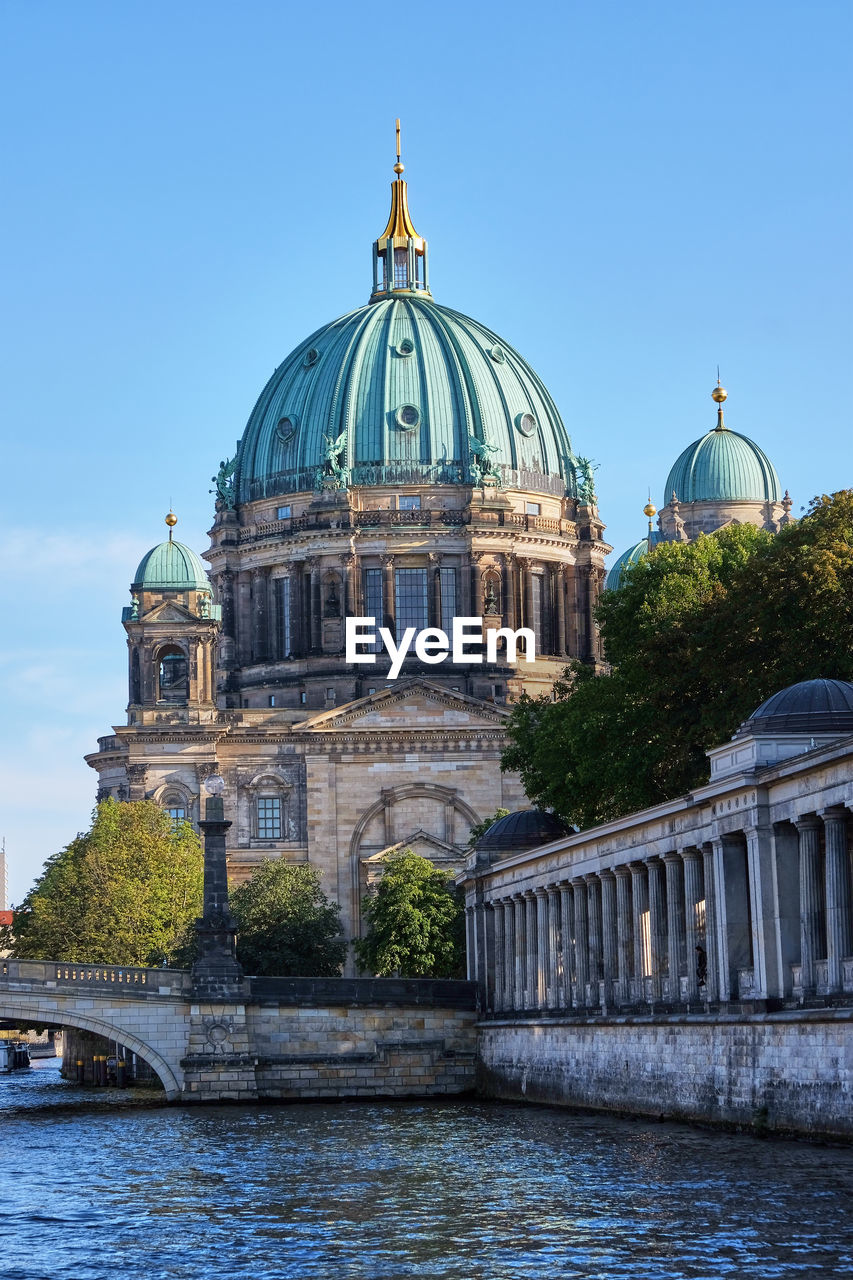 The berlin cathedral at the bank of the river spree