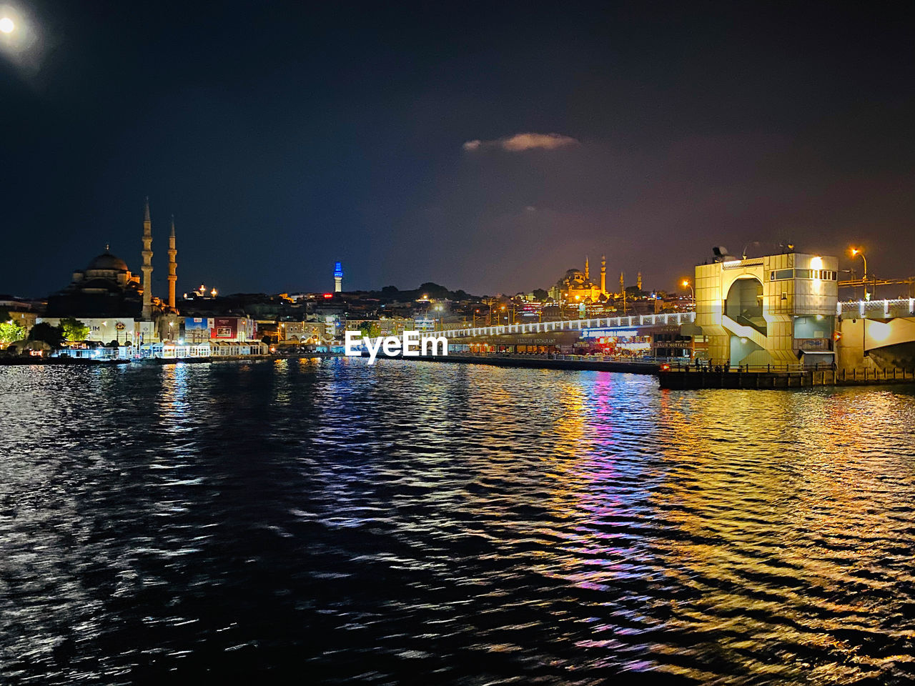 Illuminated buildings at waterfront
