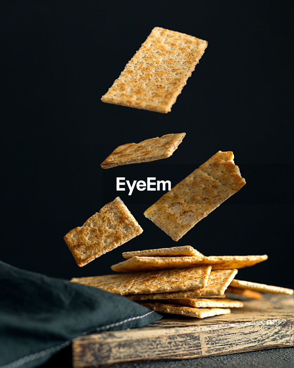Creative concept with falling food on black backdrop