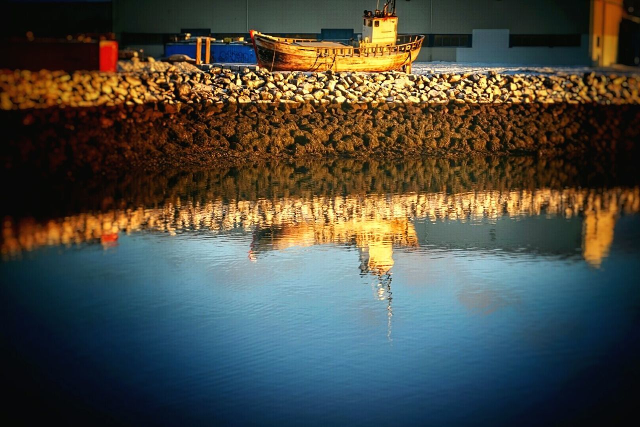 Reflection of boat in lake