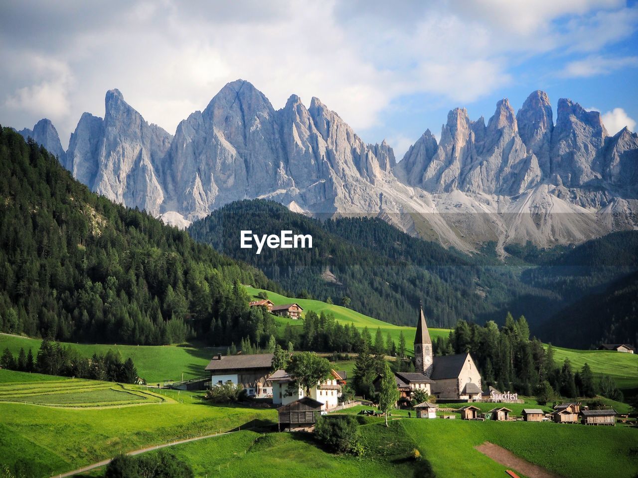 Scenic view of mountains against cloudy sky