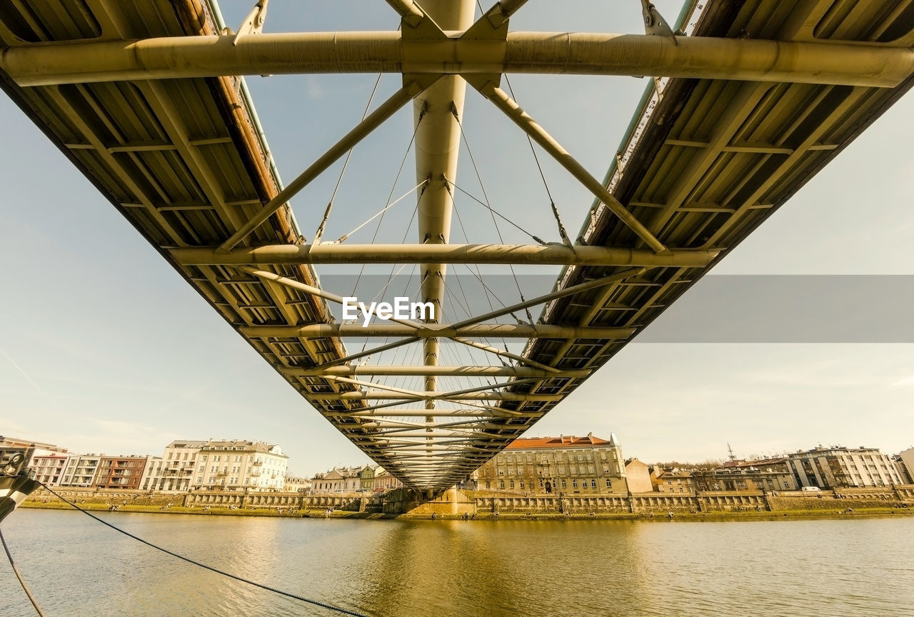  wide angle of a man made metal modern architecture of a bridge located over vistula river in poland