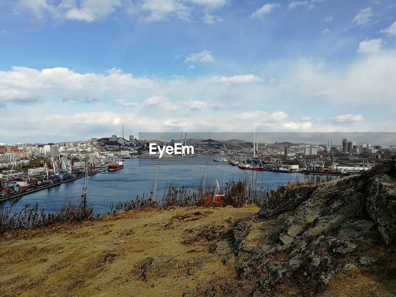 SCENIC VIEW OF SEA AND CITY AGAINST SKY
