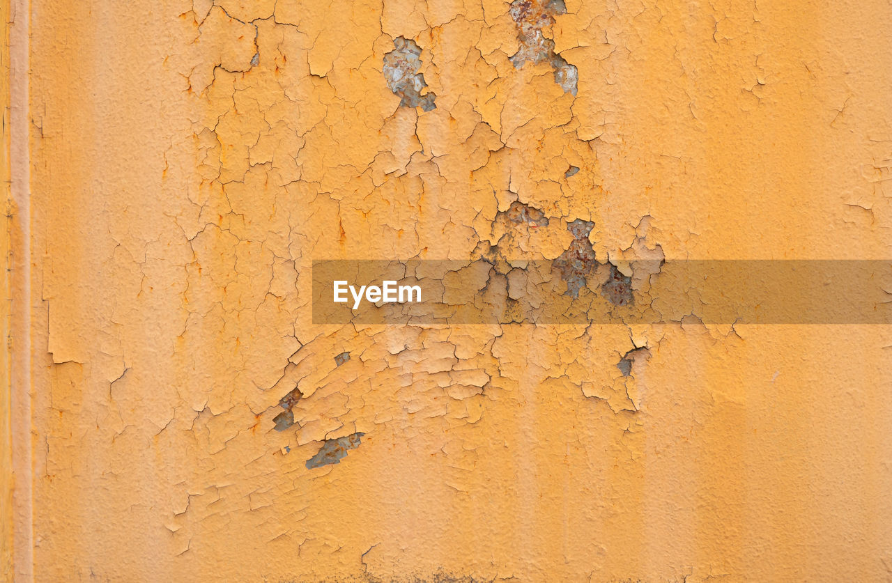 Old rusty orange plaque for the background, rust damages old plaque, old rusty orange old plaque