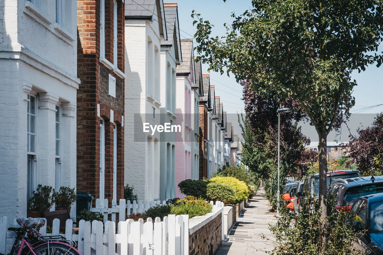 Traditional pastel coloured terraced houses in barnes, london, uk.