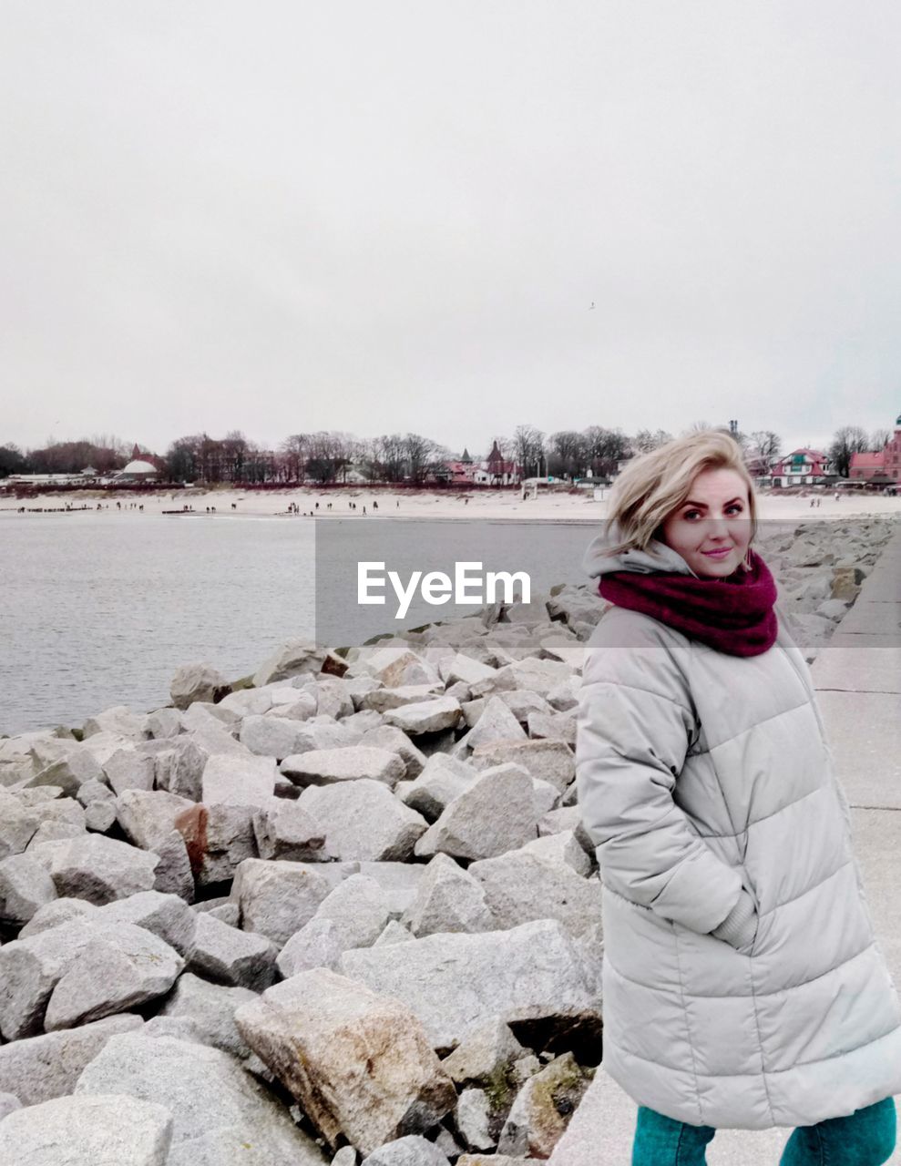 Portrait of woman standing on pier