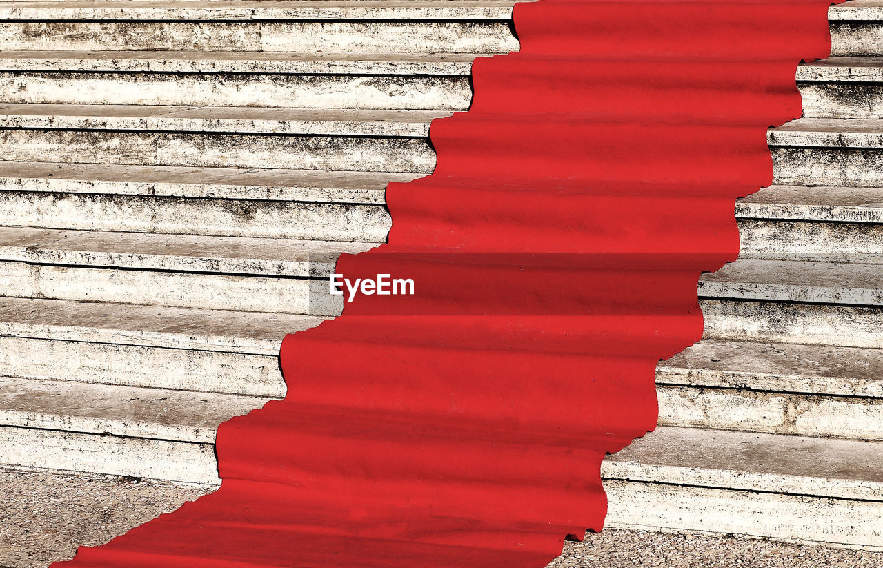 CLOSE-UP OF STACK OF RED STEPS