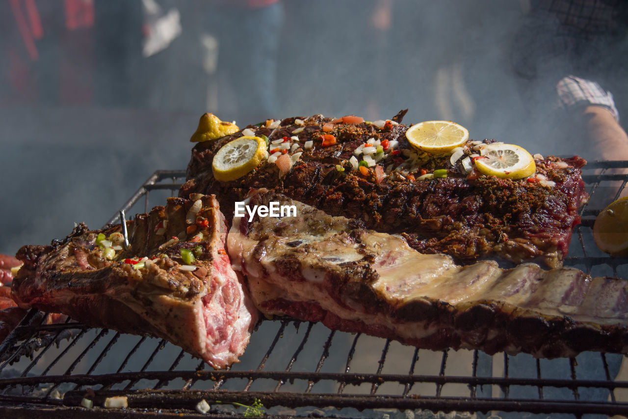 Close-up of meat on barbeque grill