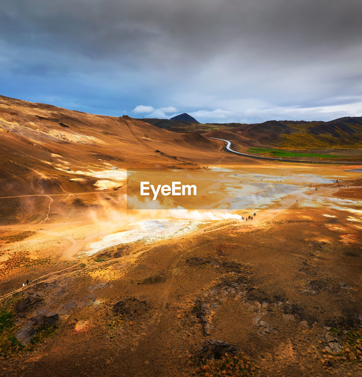 Scenic view of arid landscape against sky