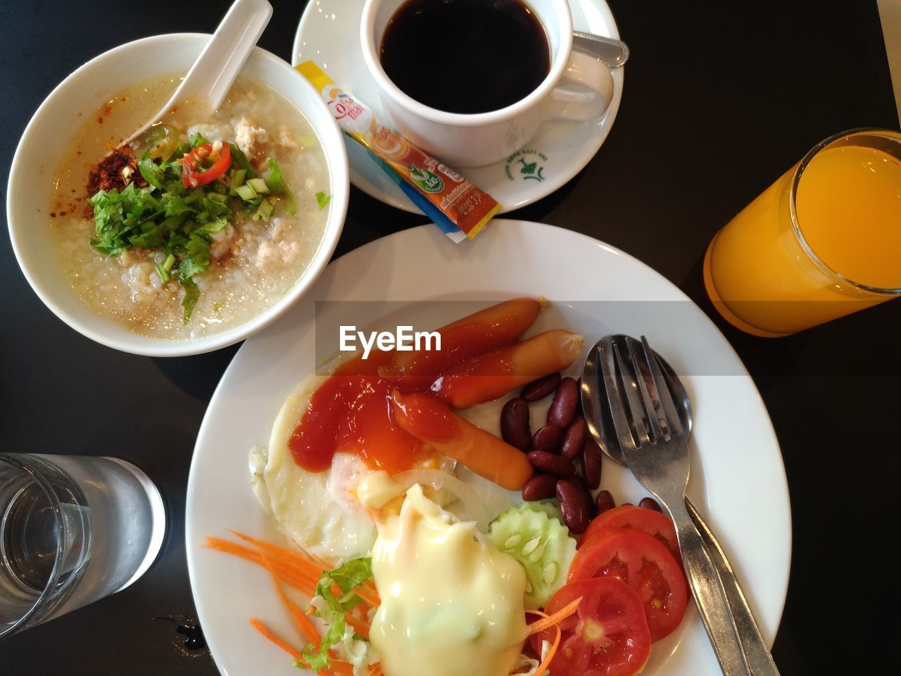 HIGH ANGLE VIEW OF BREAKFAST IN COFFEE ON TABLE