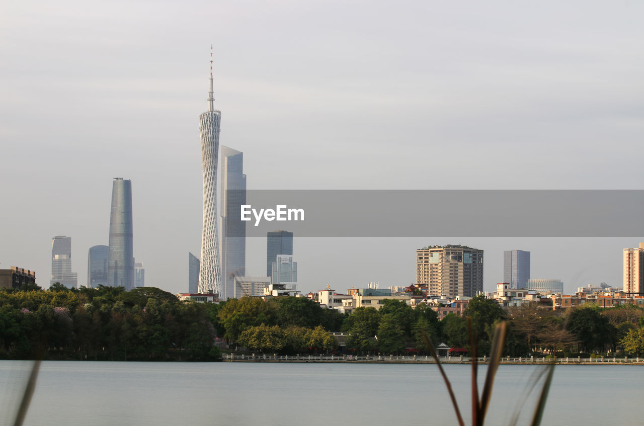 Buildings in city against sky