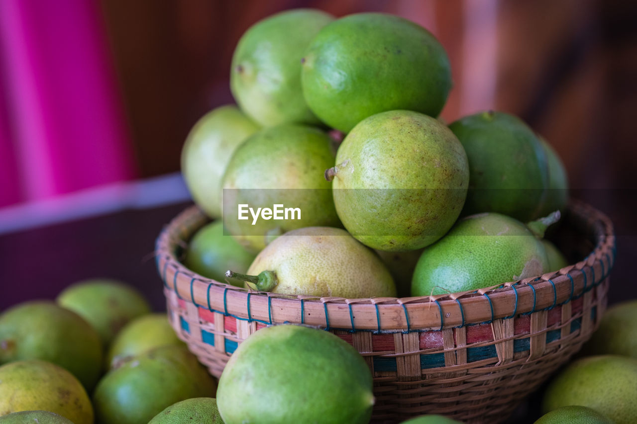 Close-up of lime lemon in basket 