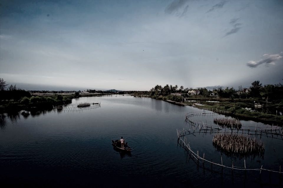 High angle view of people on boat sailing in river