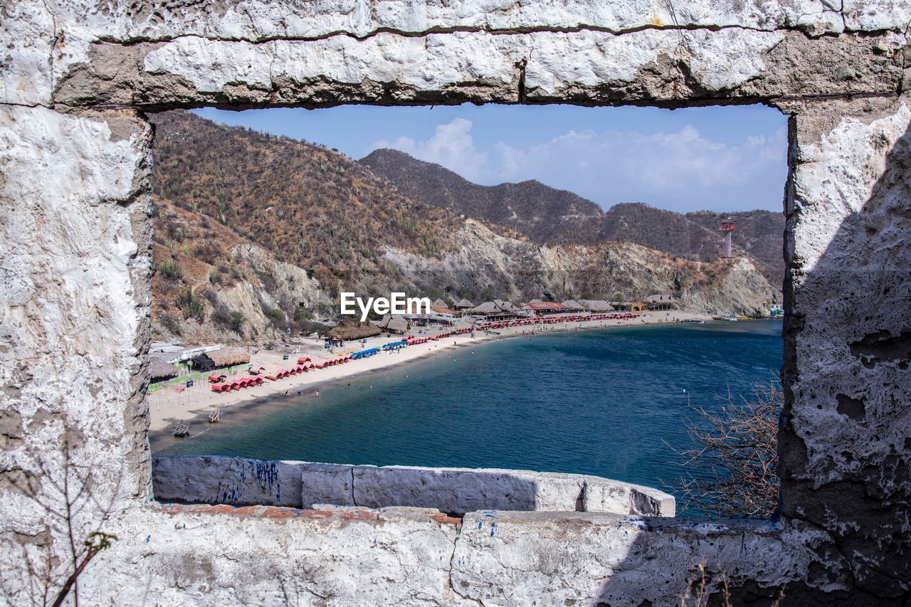 View of mountain by sea