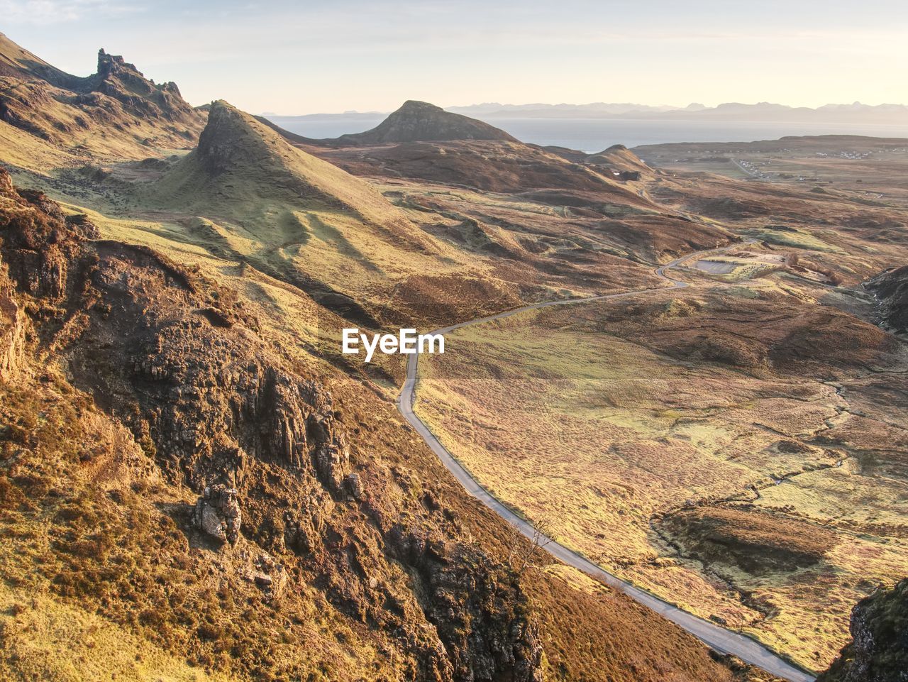 Spring view of quiraing mountains with blue sky, isle of skye. sharp rocky mountains above vallley