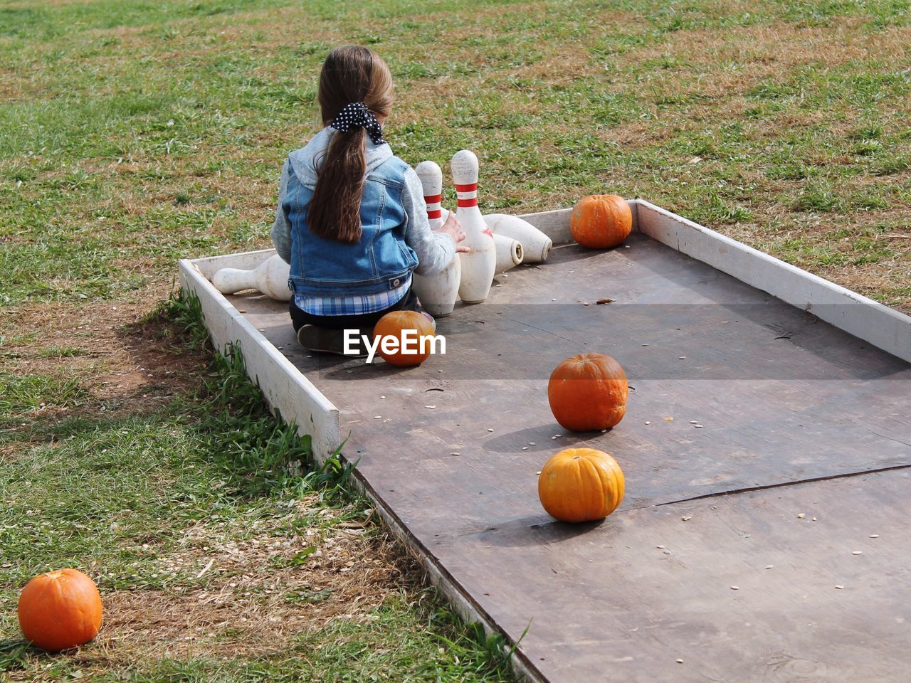 Children playing bowling at park