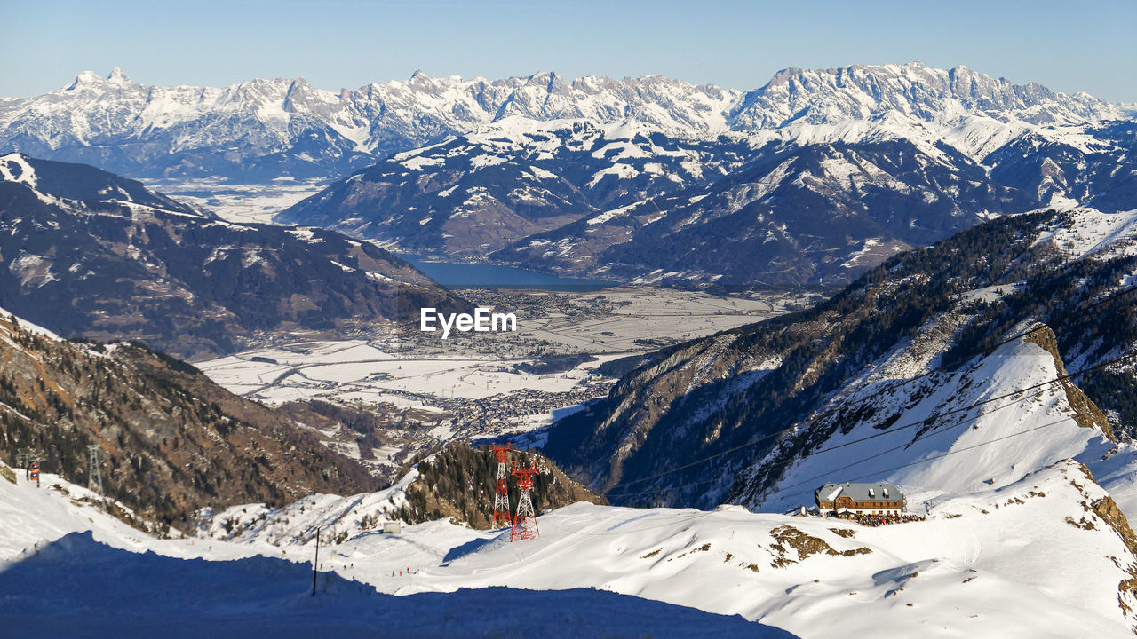 Overlook on snow sunny summits of austrian alps in winter