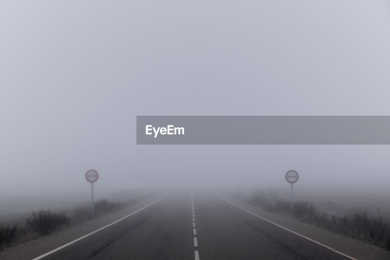 Empty road during foggy weather