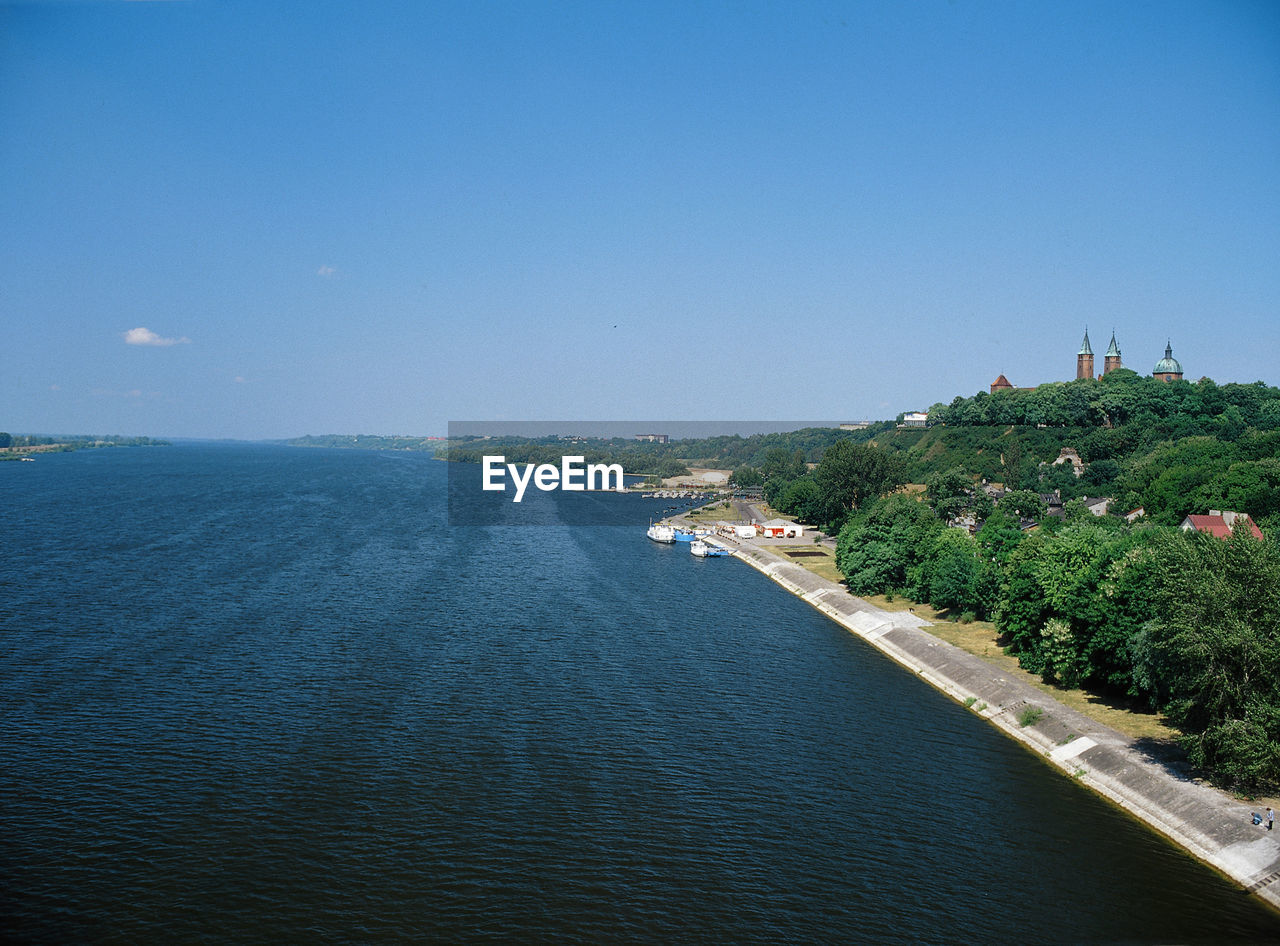 Scenic view of sea against clear blue sky