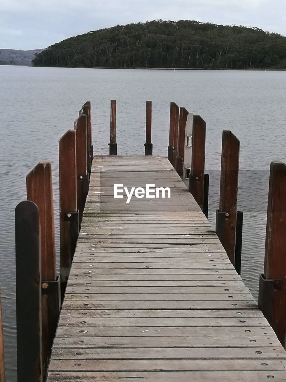 WOODEN JETTY ON PIER AT LAKE