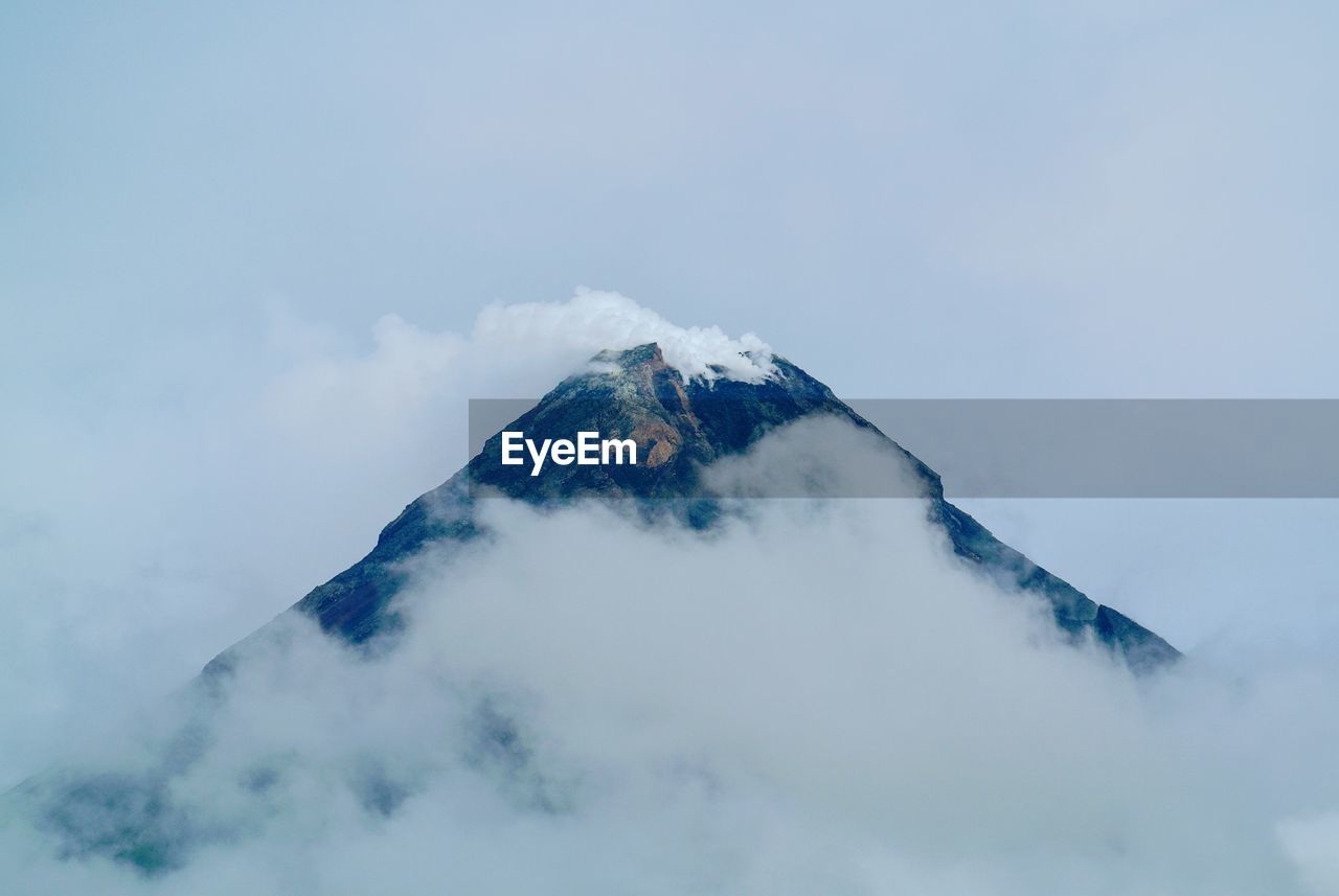 Low angle view of snowcapped mountain against sky