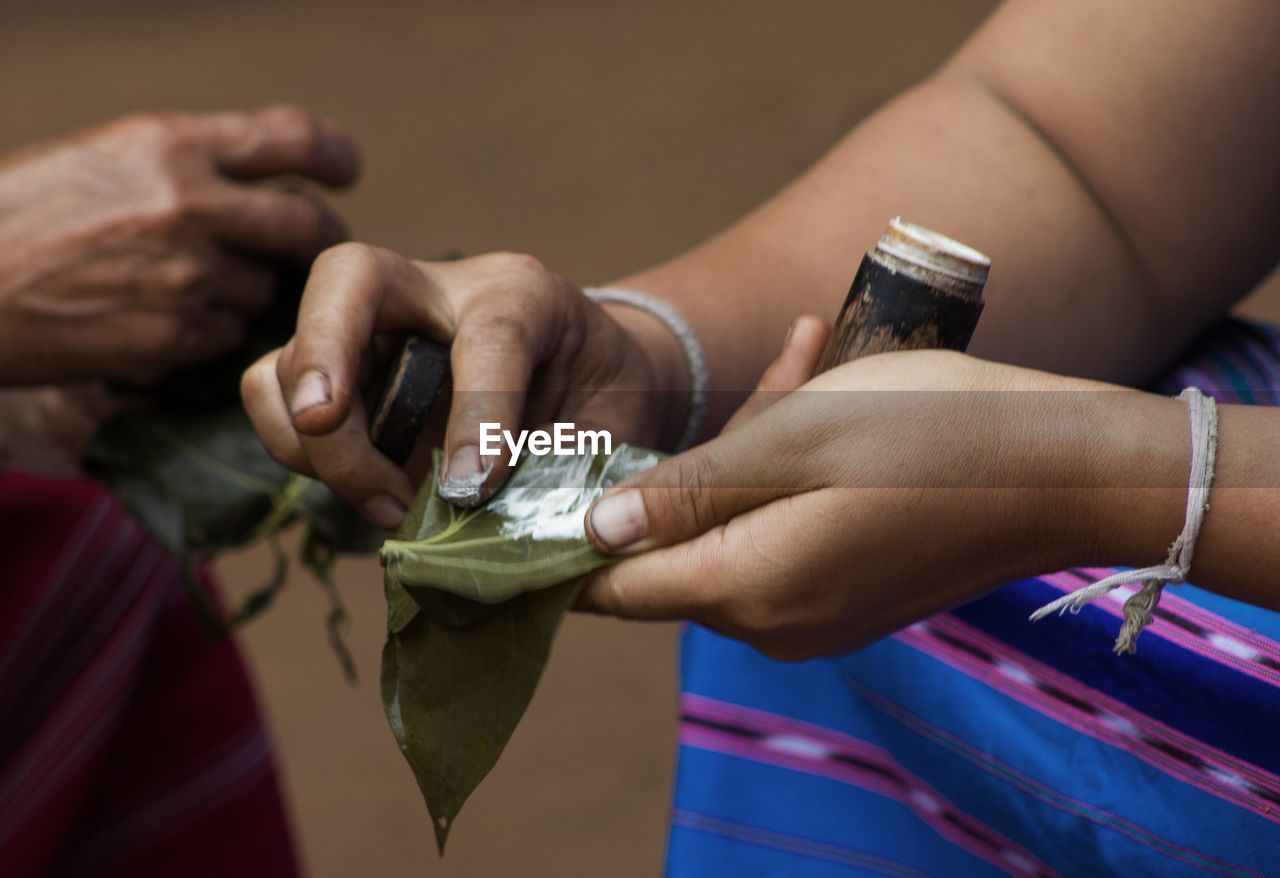 CLOSE-UP OF PEOPLE HANDS