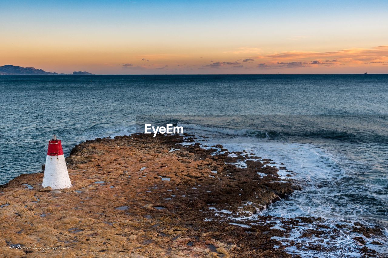 Scenic view of sea against sky during sunset