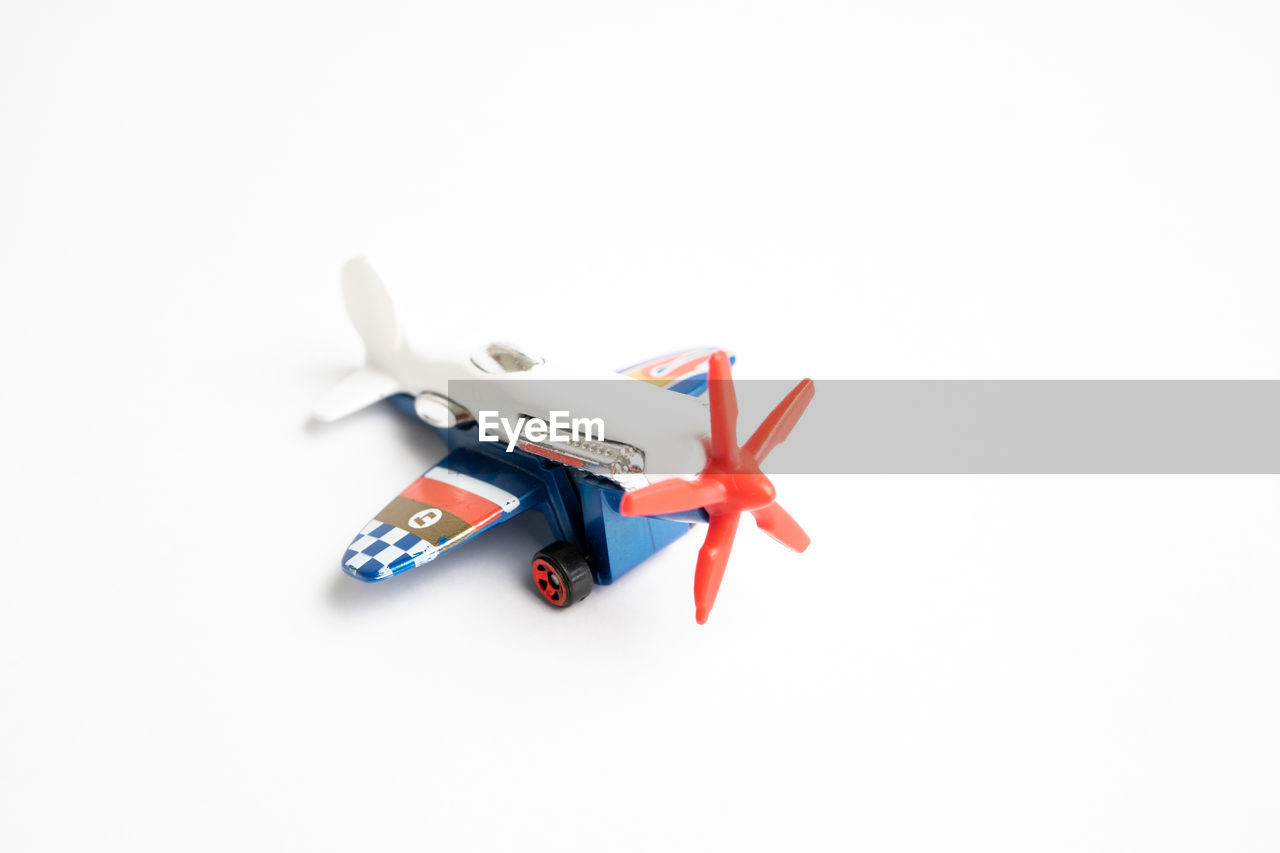 HIGH ANGLE VIEW OF TOYS ON WHITE BACKGROUND