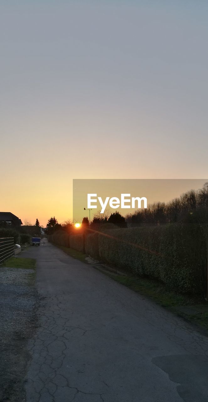 ROAD AGAINST SKY DURING SUNSET