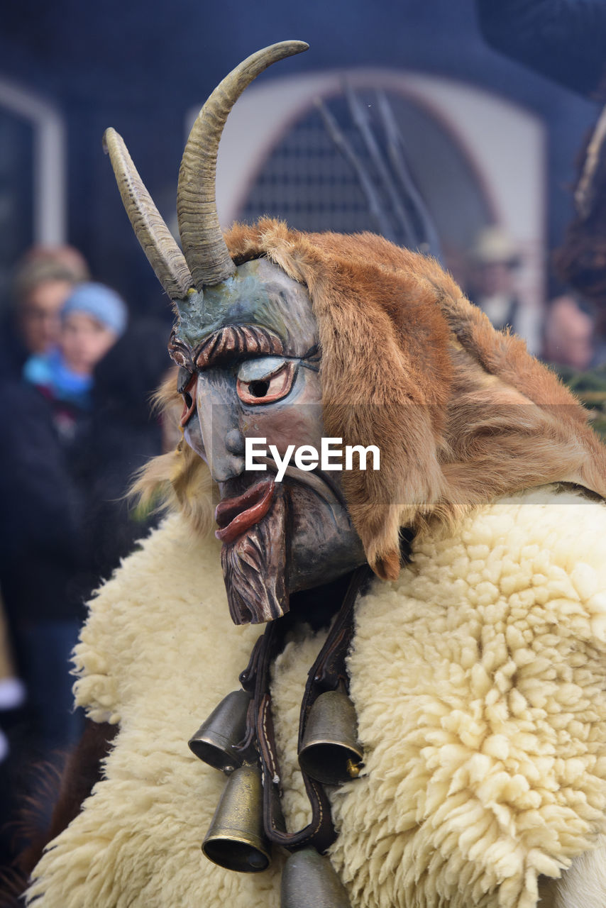 Public and traditional parade with funny masks at carnival