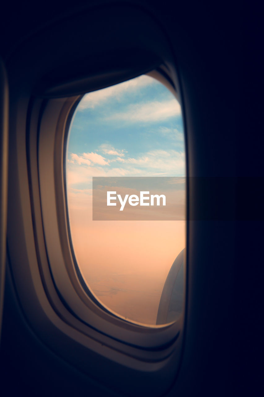 Scenic view of sky seen through airplane window