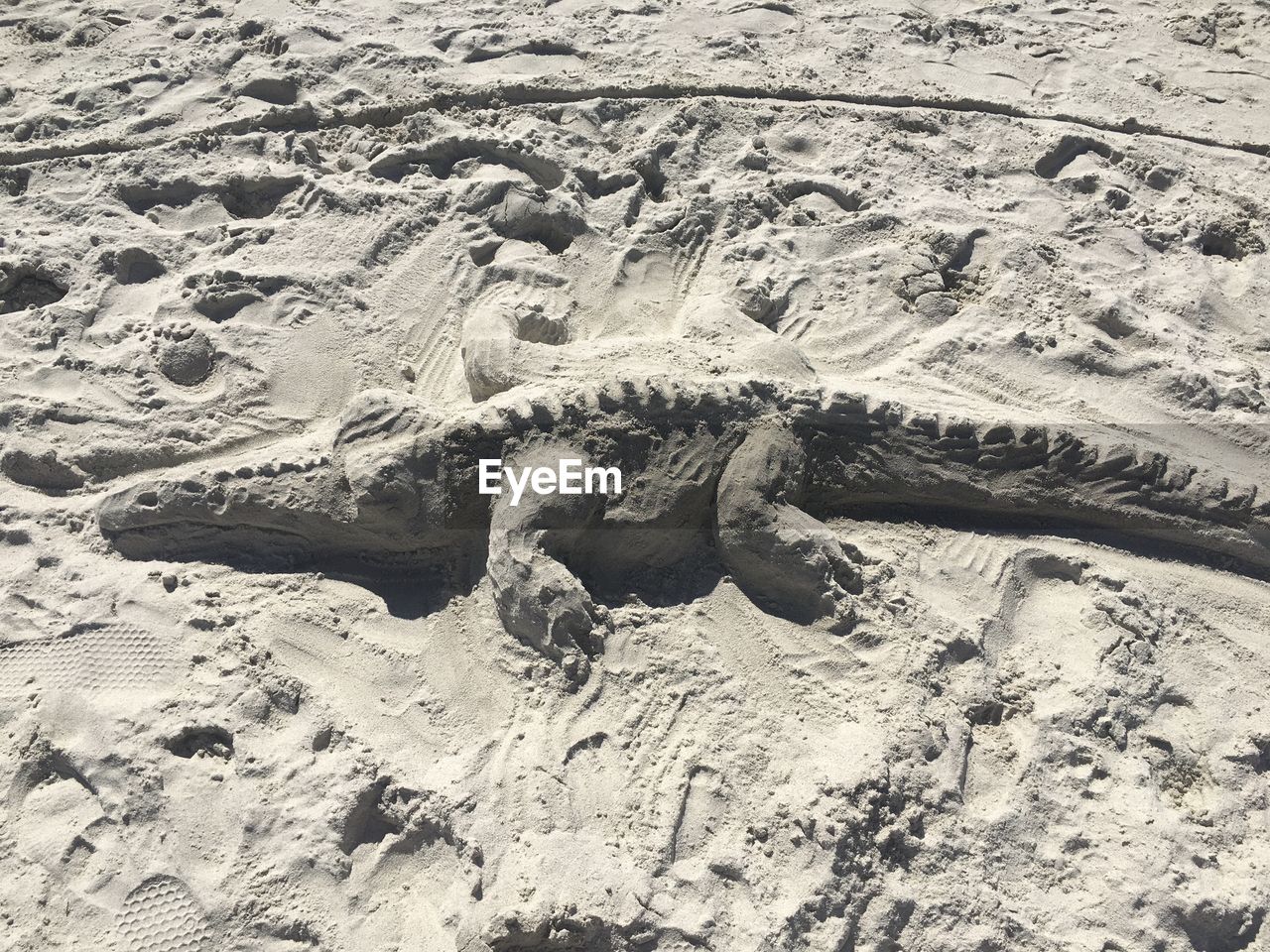 HIGH ANGLE VIEW OF SAND DUNES ON BEACH