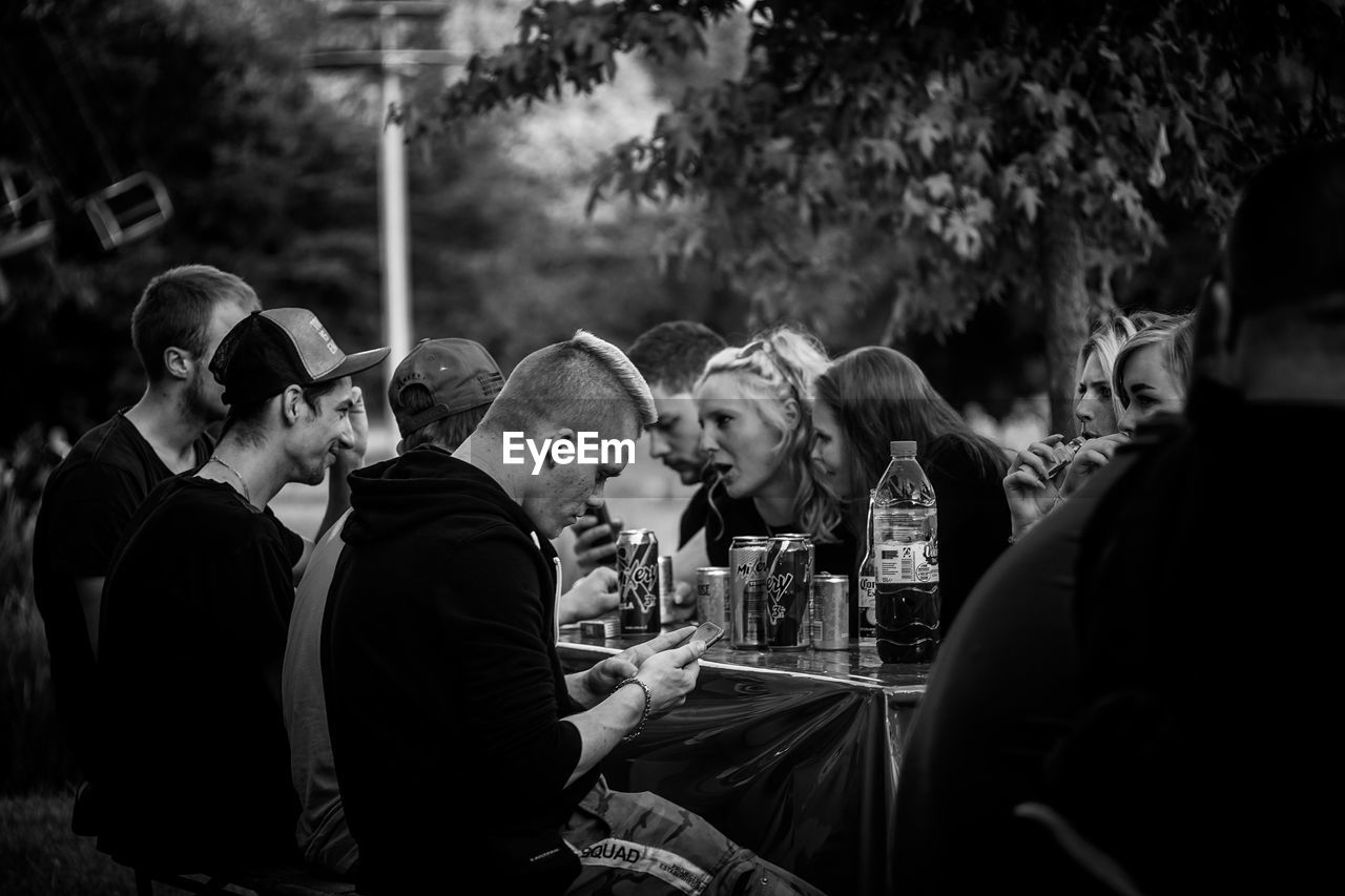 GROUP OF PEOPLE LOOKING AT MARKET