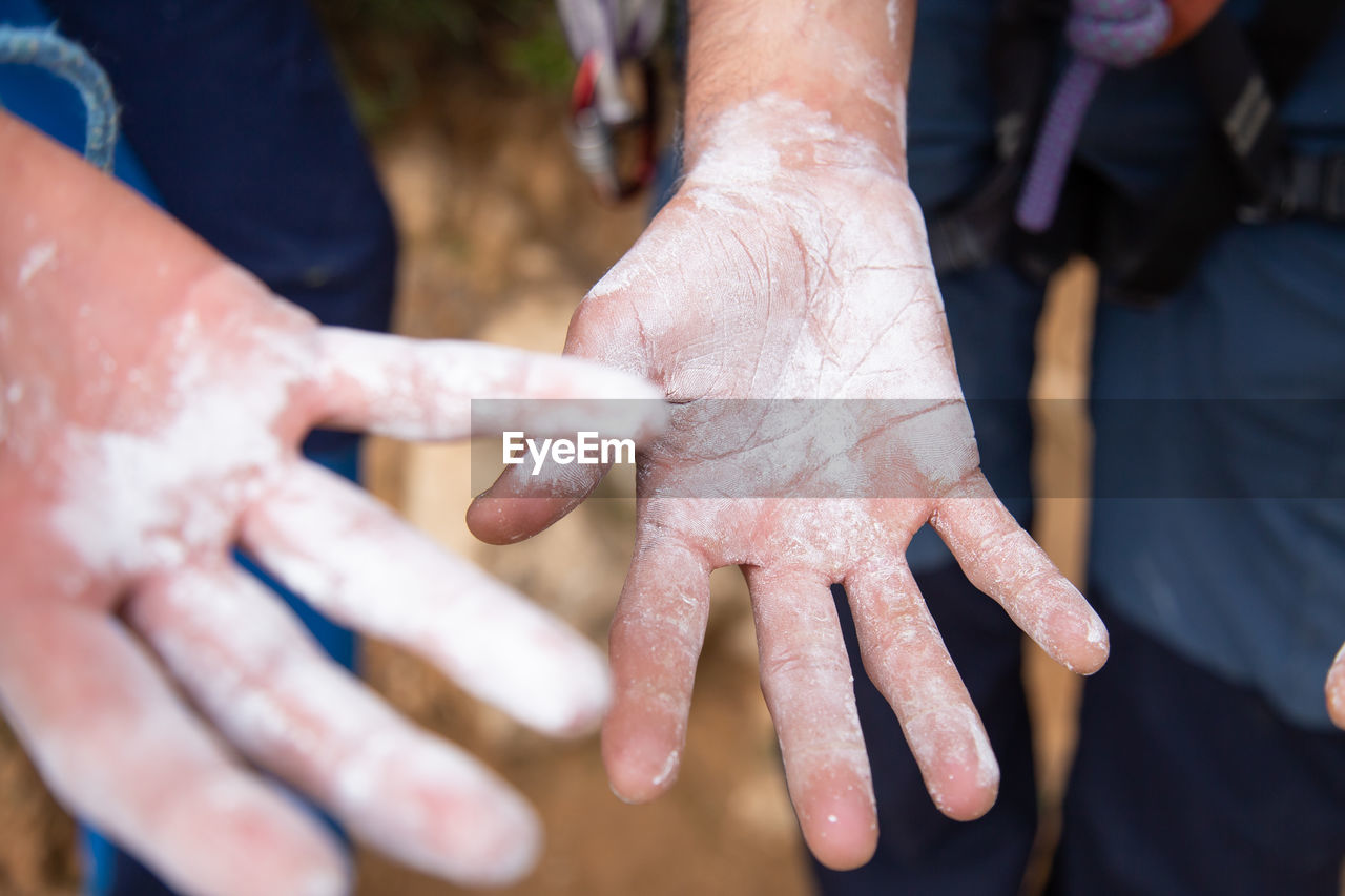 Cropped image of people with messy hands