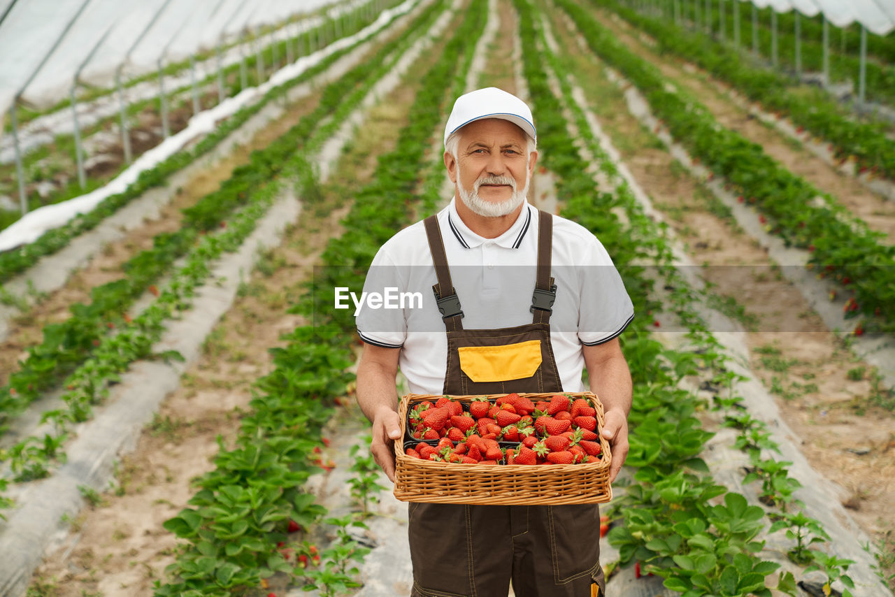 FULL LENGTH OF A MAN STANDING IN BASKET