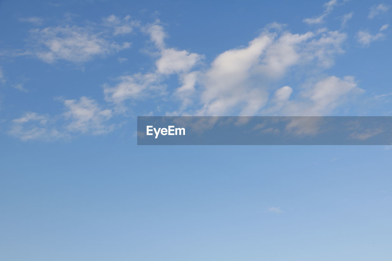 LOW ANGLE VIEW OF SKY AND CLOUDS IN THE BACKGROUND