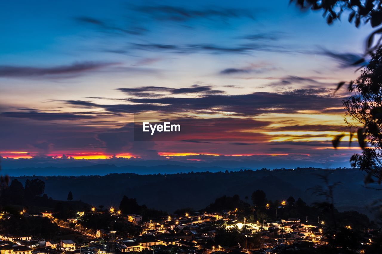 Aerial view of city at sunset