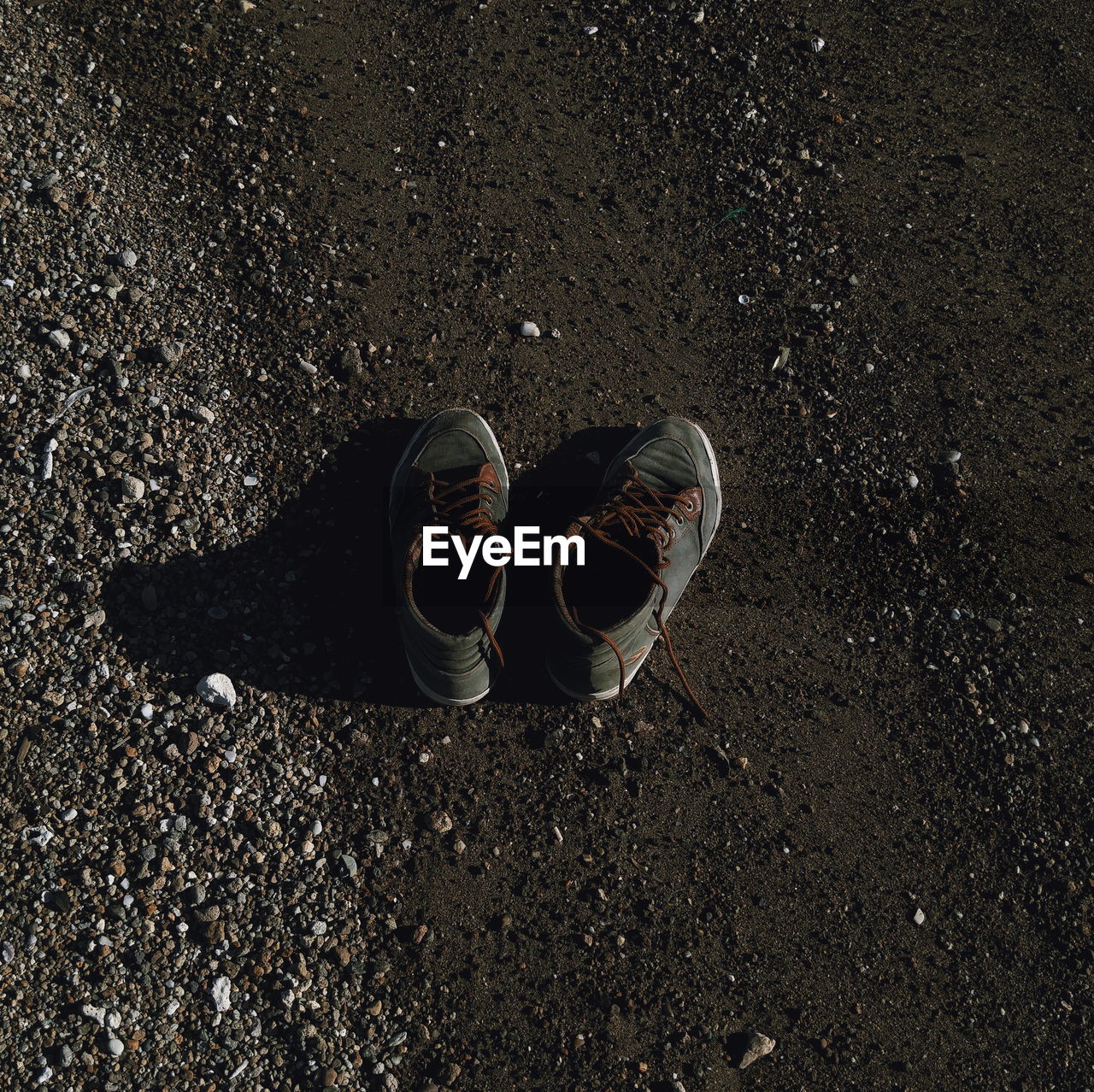 High angle view of shoes on sea shore