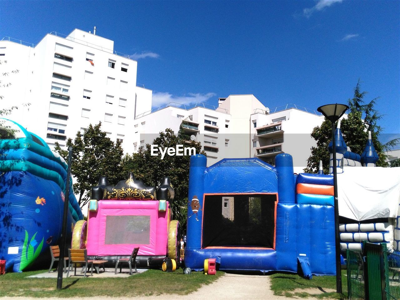 LOW ANGLE VIEW OF BUILDINGS AGAINST CLEAR BLUE SKY