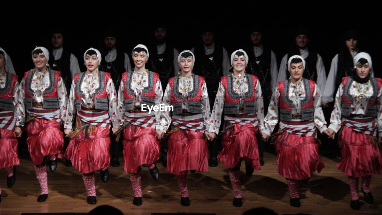 GROUP OF PEOPLE IN TRADITIONAL CLOTHING